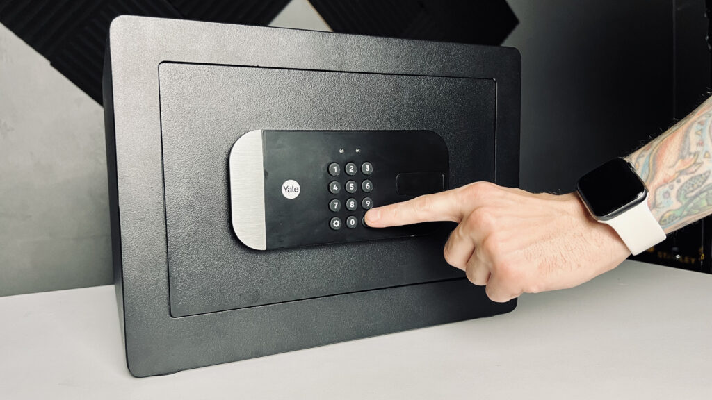 closeup unlocking the Yale Smart Safe via its physical keypad