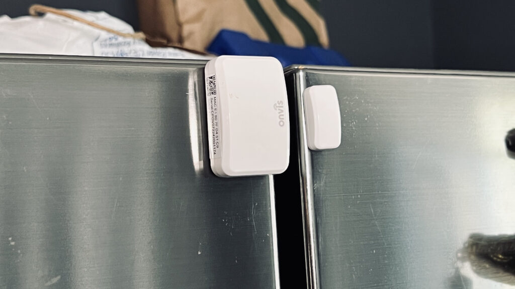 the CT3 Door & Window sensor mounted on a silver refrigerator